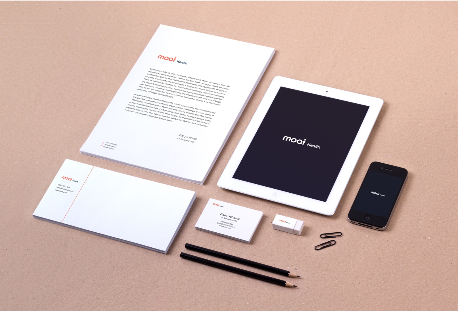 Stationary designs - company logo shown on an ipad and iphone, on a letter, A4 document and business card design