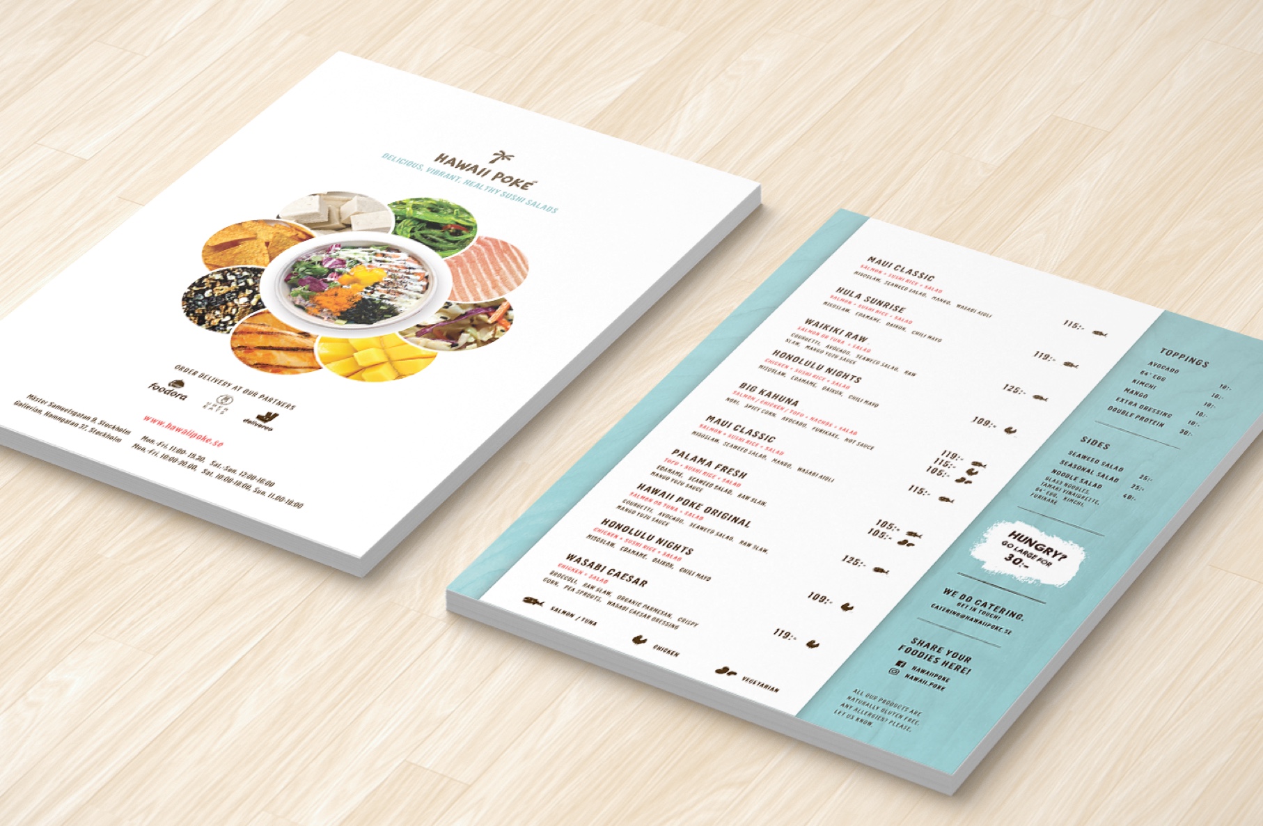 Menu flyer for a restaurant Hawaii Poke in Stockholm, laying on the wooden table and presenting front and back sides.